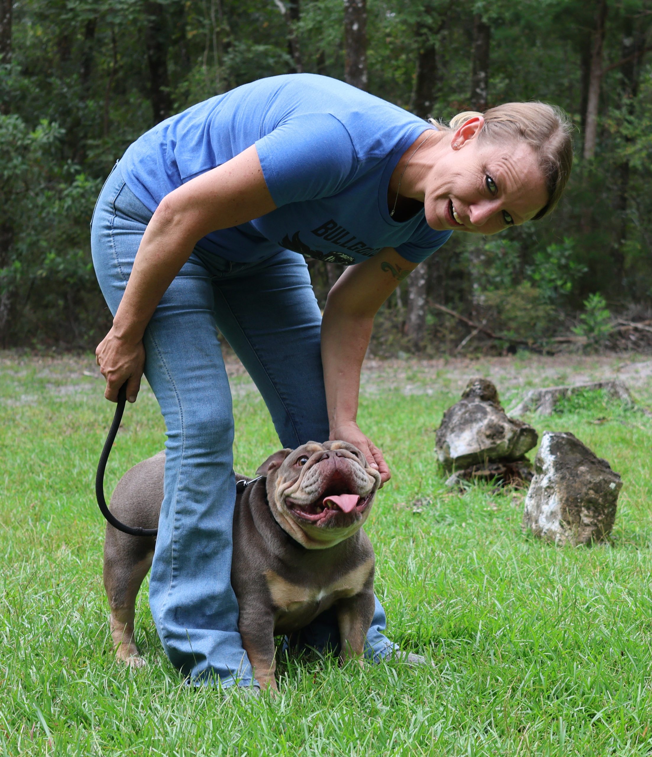 Nicole Willett working hands-on with Venus, an English Bulldog, demonstrating ethical, in-home breeding practices focused on health, structure, and temperament